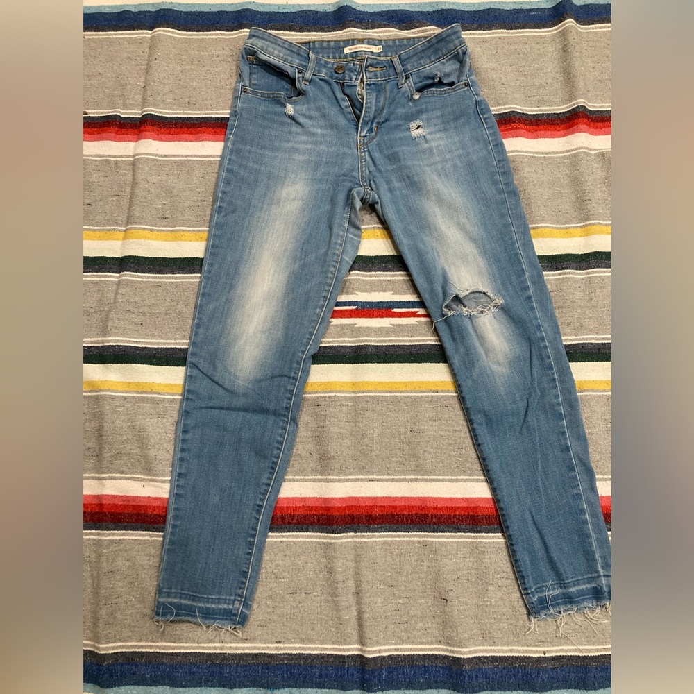 Levi Strauss 721 High Rise Skinny distressed light wash jeans, size 27